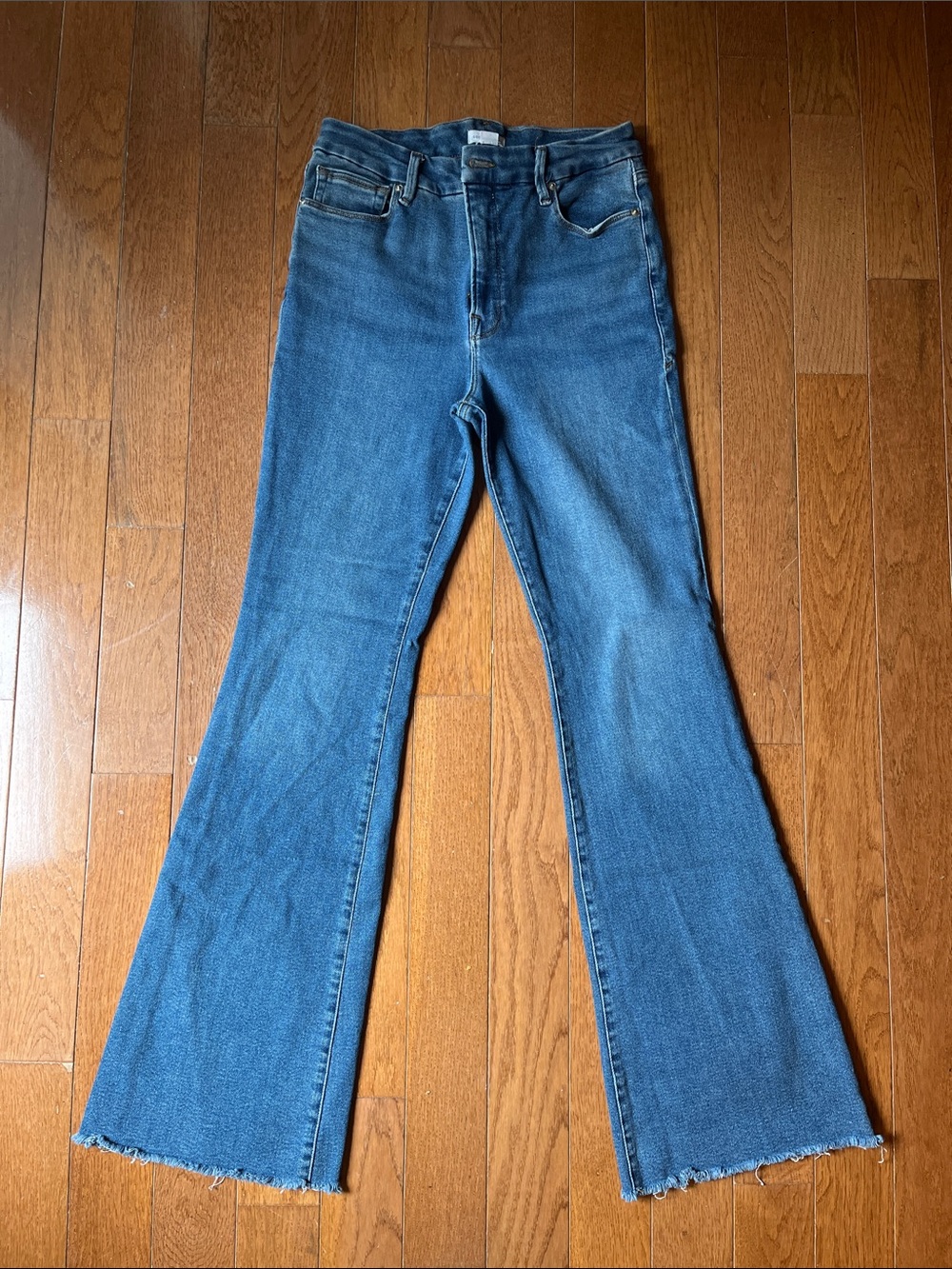 Good American Medium Blue Raw Hem Flare Leg Jeans